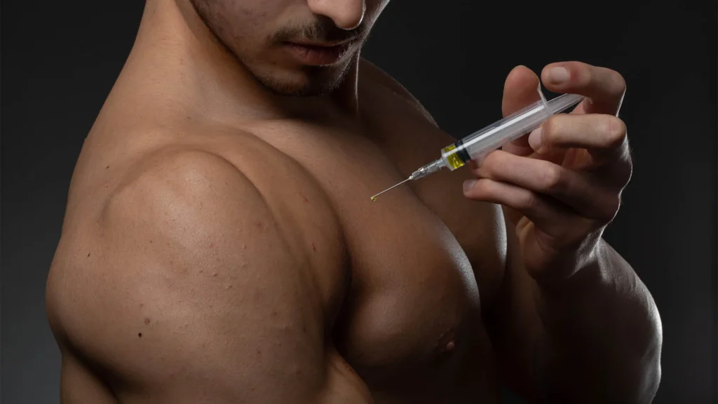 a man holding a syringe